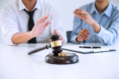 couple arguing before signing divorce papers