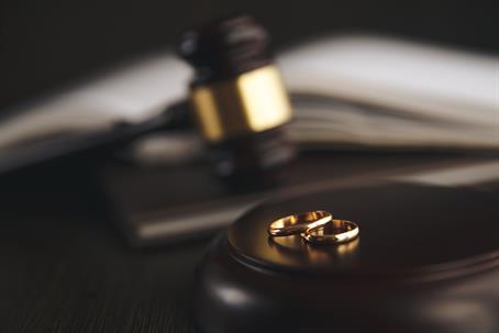 wedding bands and wooden gavel