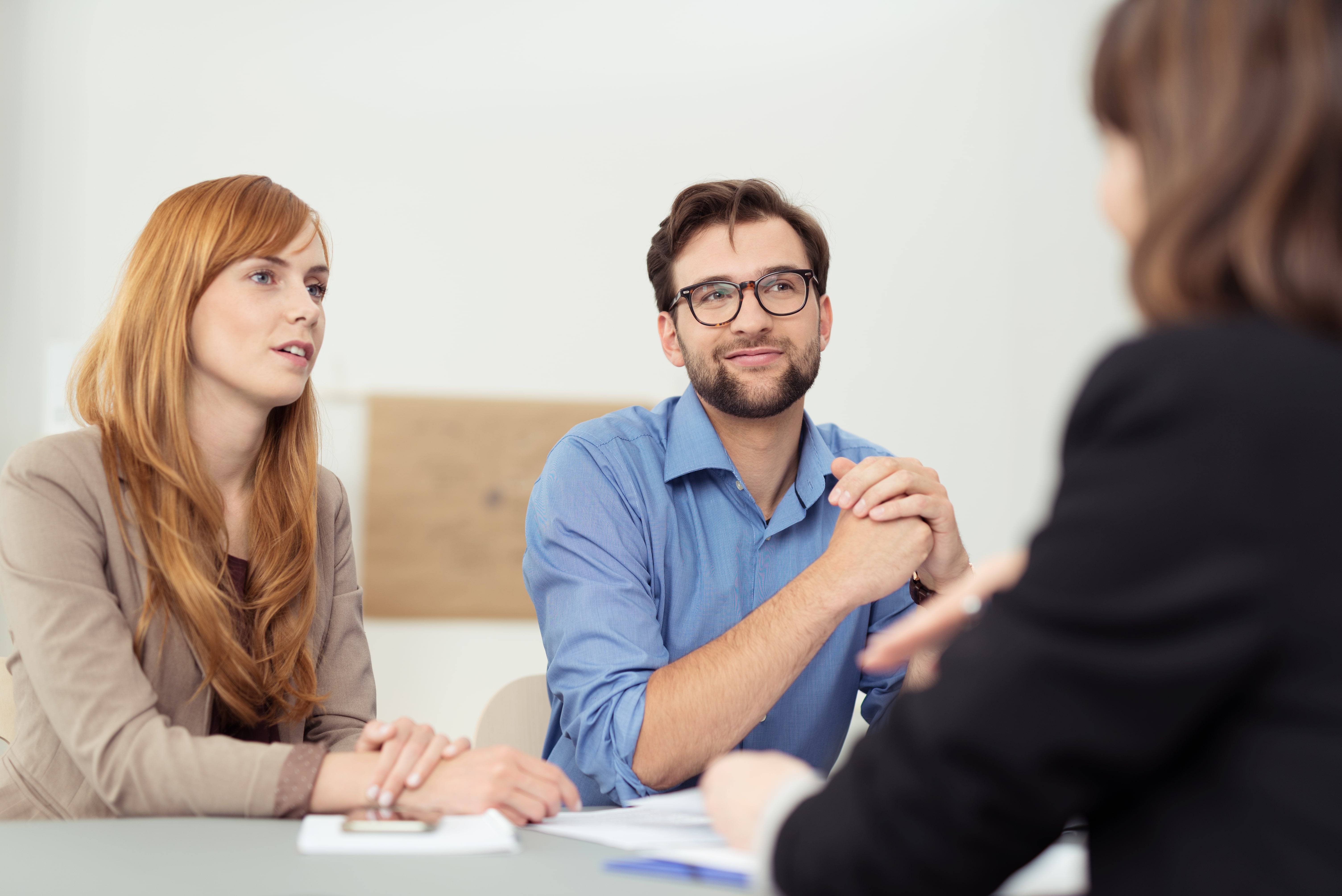 couple drafting a prenup with a lawyer